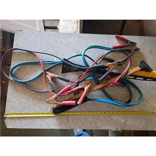 Booster cables and snow brushes