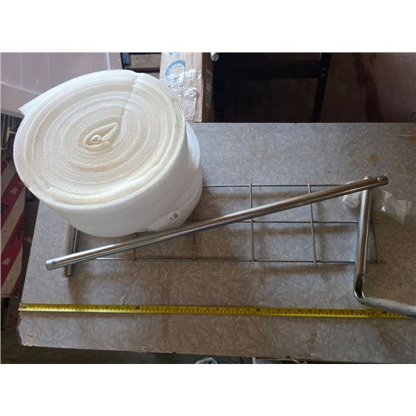 2 rolls of insulation and steel shelf