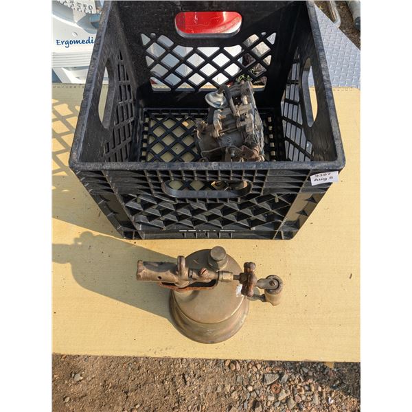Vintage gasoline torch with milk crate and carburator