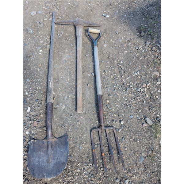 Spade, pick axe and garden fork