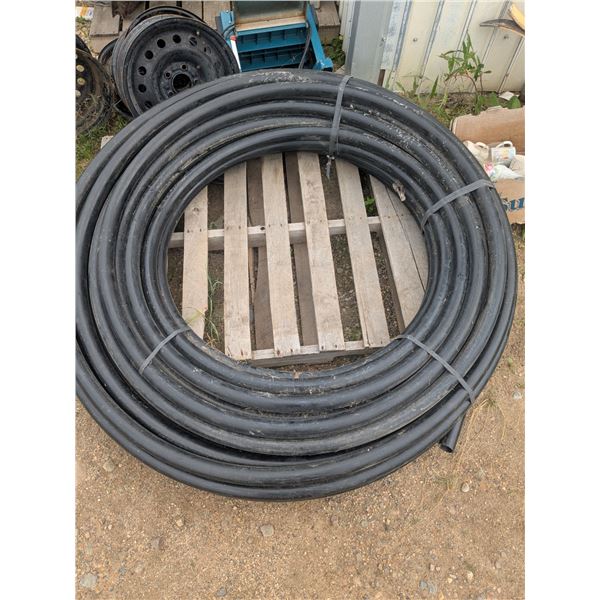 Large roll 1" poly pipe with small roll 3/4" poly pipe