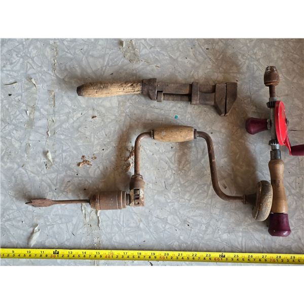 2 antique hand drills and wrench