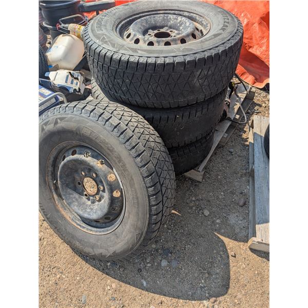 set of tires on rims, 6 bolt, R17, two very bald, other 2 low tread