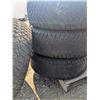 Image 3 : set of tires on rims, 6 bolt, R17, two very bald, other 2 low tread