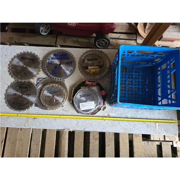 Various sizes of saw blades and milk crate