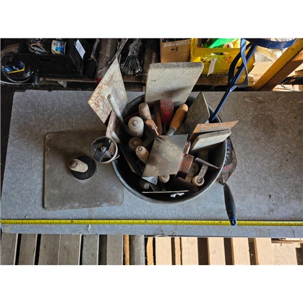 Lot of trowels and drywall tools