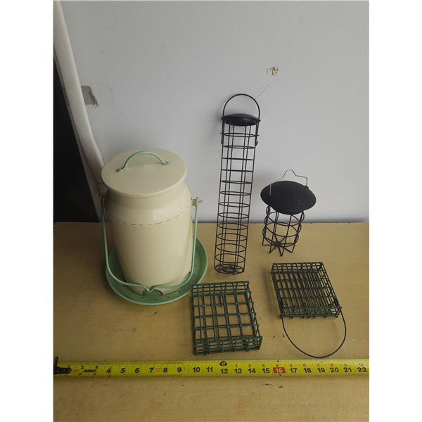 Various types of metal bird feeders.