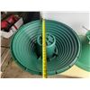 Image 4 : Vintage-style green and red hard plastic Christmas tree stand.