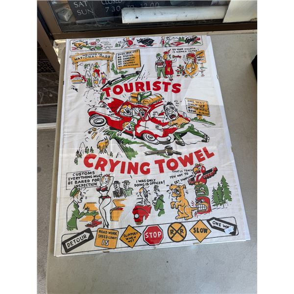Tourist crying towel