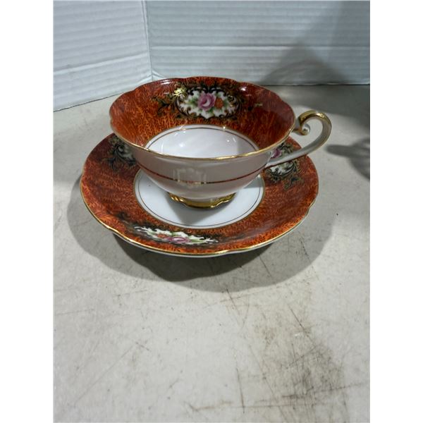 Castle, teacup, and saucer occupied Japan