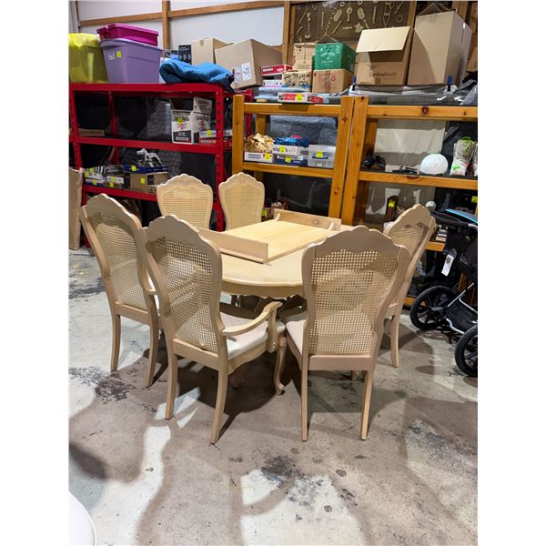 Table and chairs on chair needs leg repai 2 have damage in the back see picture