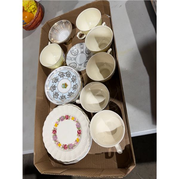 Tea cups and saucers inside plates