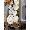 Image 2 : Tea cups and saucers inside plates
