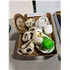 Image 1 : A lot of cups and saucers, sugars and creamers, as well as home decor