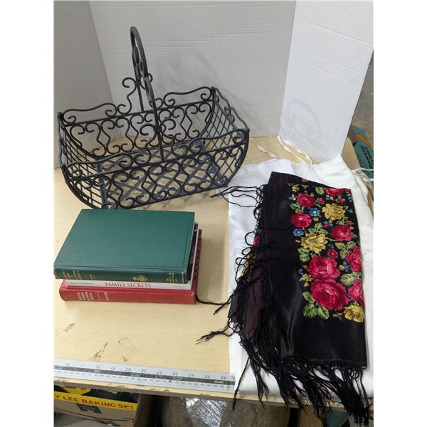 Powder coated steel basket with vintage books, and table clothes