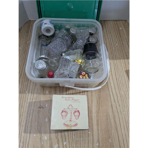 Bucket of mixed salt and pepper shakers