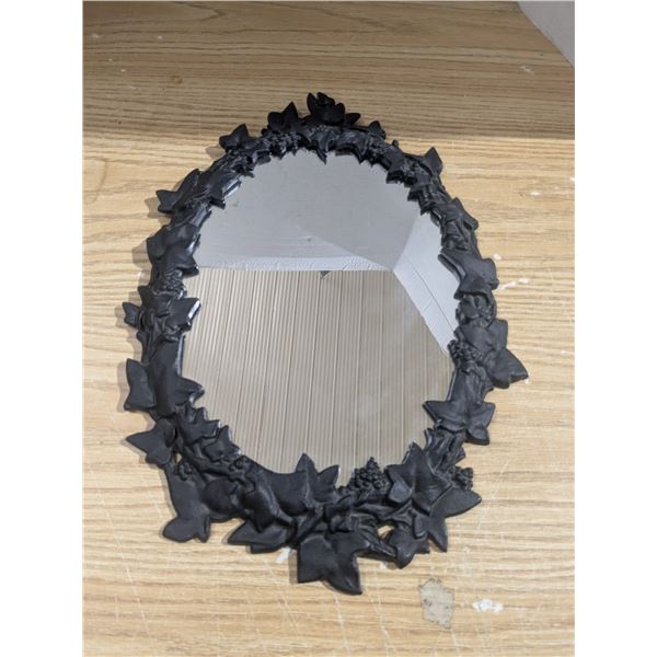 Oval mirror with cast iron frame, 17x12"