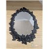 Image 1 : Oval mirror with cast iron frame, 17x12"