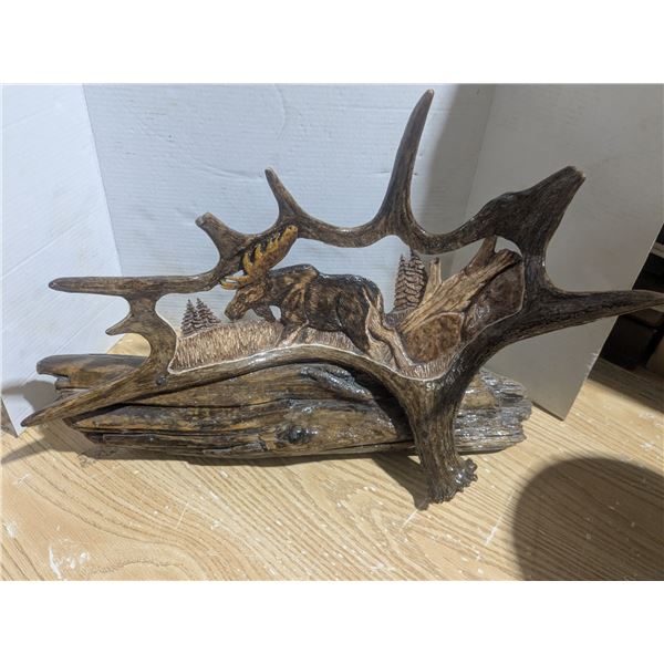 Carved antler on driftwood Art