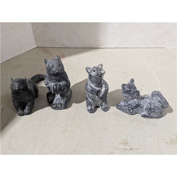 4 stone carvings - squirrels, racoon, fox