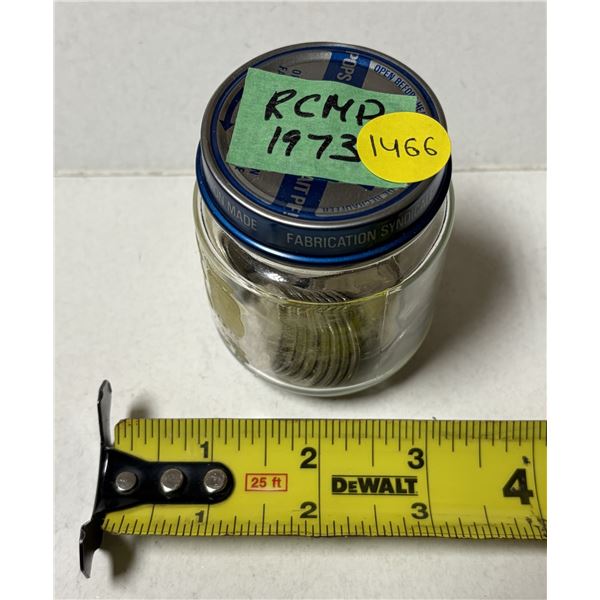 Jar of Canadian 1973 RCMP 25 Cents Coins.