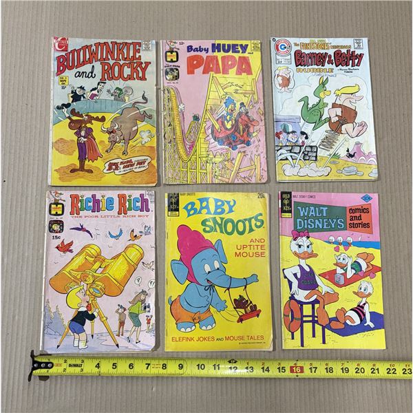 Vintage children's comic books from publishers like Harvey Comics and Whitman, including titles such