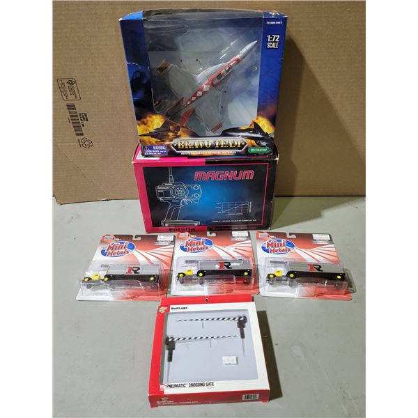 Assorted Toys: R/C Controller, Delivery Trucks, Fighter Jet, & More