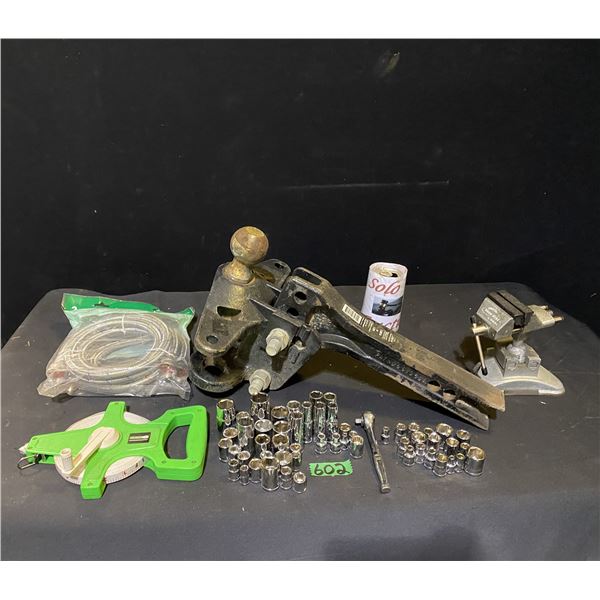 Trailer hitch and assorted tools including socket set and measuring tape, bench vice and more