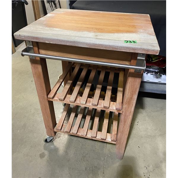 Portable kitchen cutting block on casters with shelves