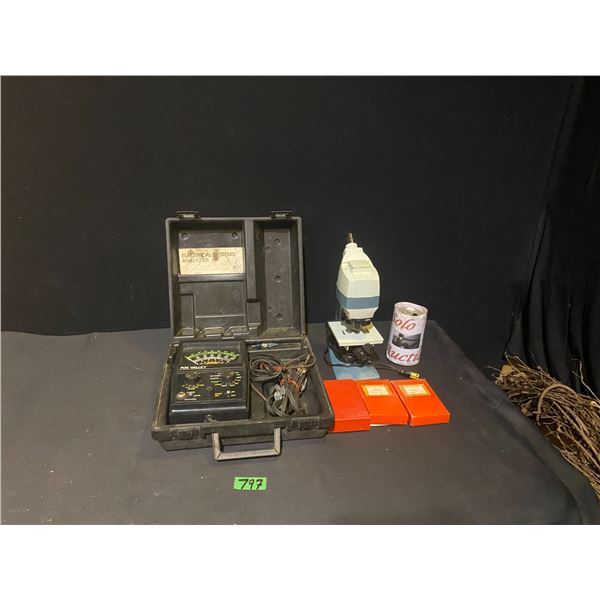 Electrical system analyser set in carrying case and microscope