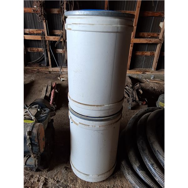(2) White Barrels with Rags Inside