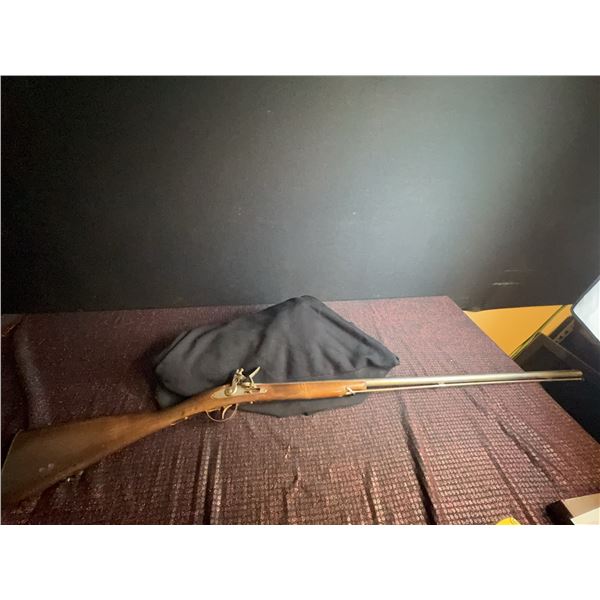  VALID PAL REQUIRED Belgian-made flintlock long gun featuring a wooden stock and metal lock mechanis