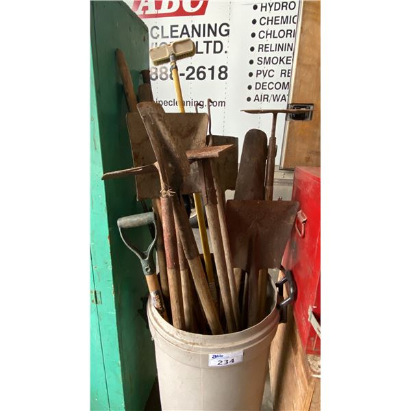 BIN OF ASSORTED SHOVELS, PICK AX & 2 MANHOLE LIFTERS