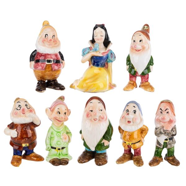 An Enesco "Snow White and the Seven Dwarfs" Ceramic Figure Set.