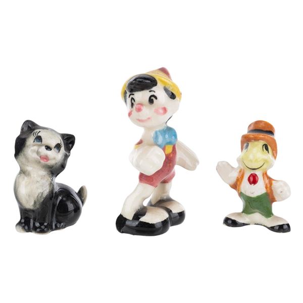 Three Evan K. Shaw “Pinocchio” Miniature Figurines.