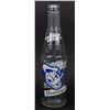 Image 1 : A Donald Duck Beverages Bottle.