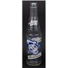 Image 2 : A Donald Duck Beverages Bottle.