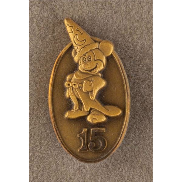 A Disneyland Cast Member 15 Year Service Pin.