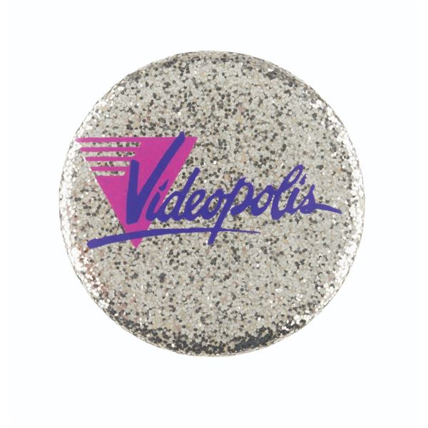 A Disneyland Videopolis Button.