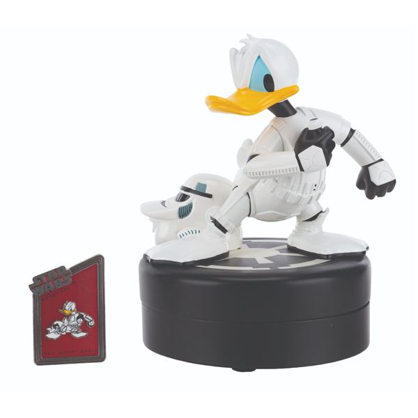 A Donald Duck Stormtrooper Figurine and Pin.