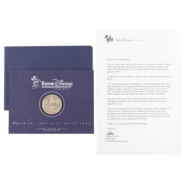 A Euro Disney Cast Member Grand Opening Coin and Letter.