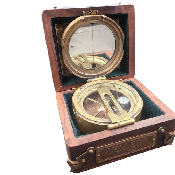 Detailed brass compass in wooden box