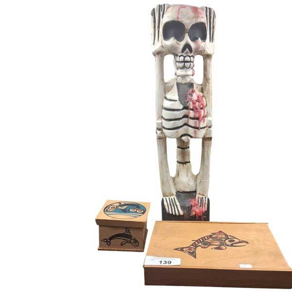 2 indigenous wooden boxen and skeleton figure
