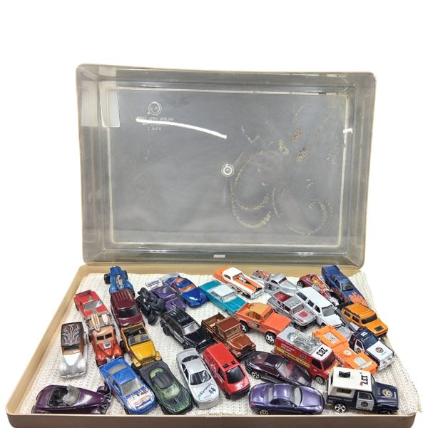 Approx 30 Hotwheels in display case