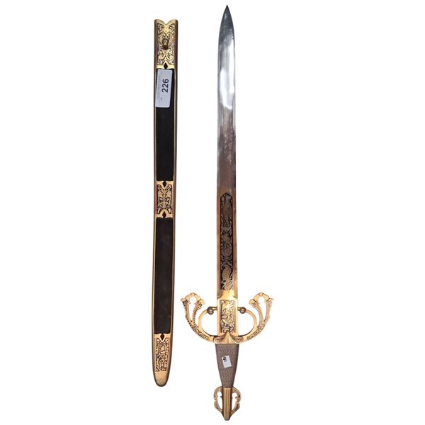 Beautiful vintage sword with brass and suede sheath and ornate handle 31"
