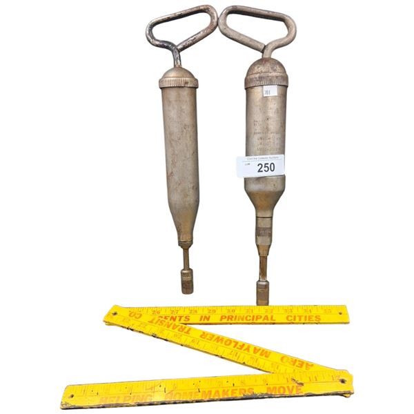 2 vintage Alemite Hydraulic grease guns and vintage yard stick