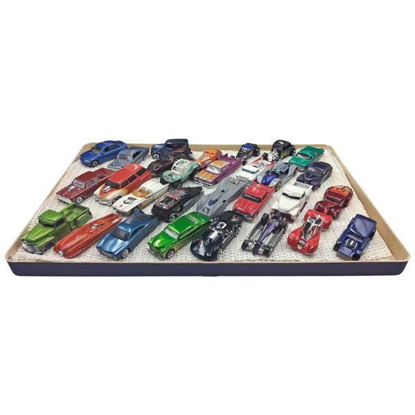 Approx 30 die cast cars in case