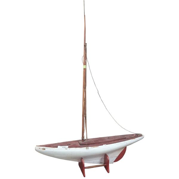 Vintage wooden sailboat model on stand 32" long