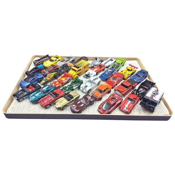 Approx 30 vintage die cast cars in case