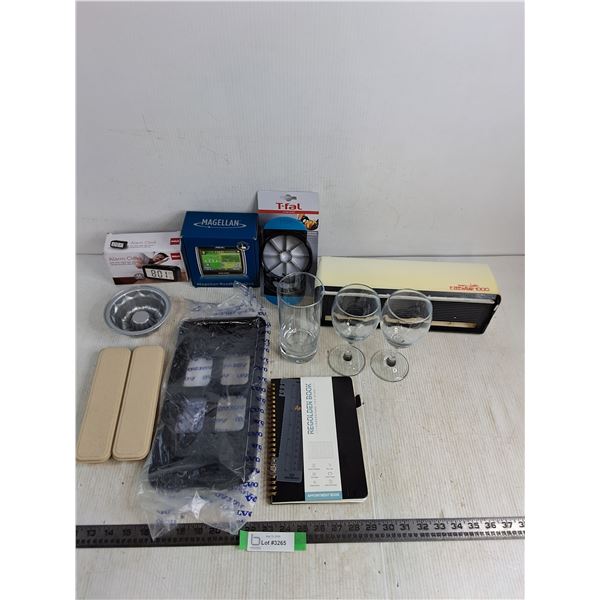 NIB Alarm Clock, Magellan GPS, T-Fal Slicer, Volvo Part, Glassware, Ezeewrap, Appointment Book, Misc